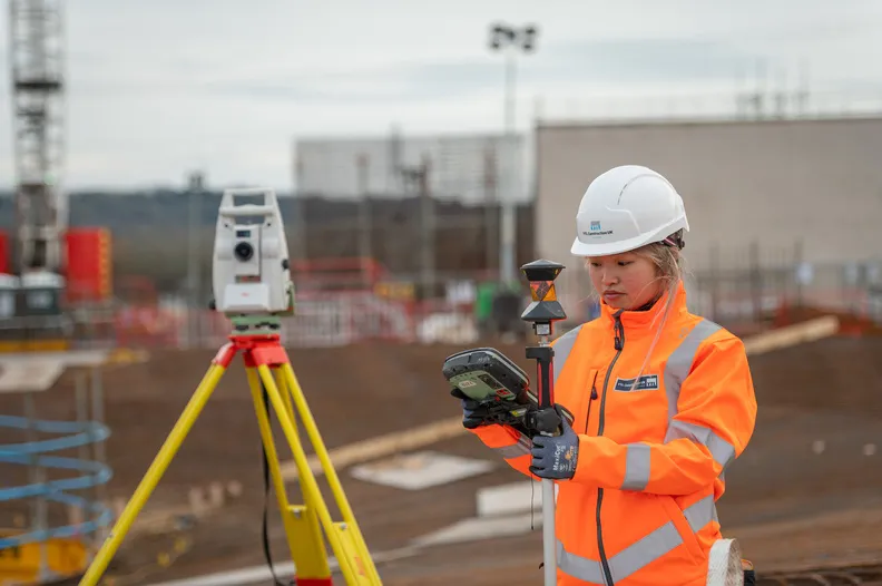 Employee carrying out a survey on site